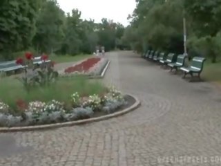 Beautiful amateur gets naked in a park for money
