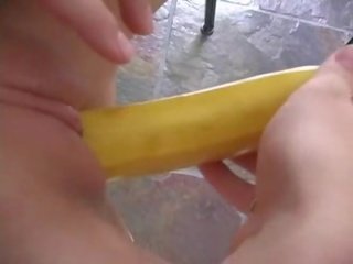 Shaved pussy having fun with a bannana Video