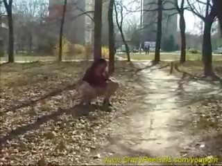 Busty whore pisses outdoor